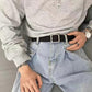 Woven canvas belt with square buckle worn with light blue denim jeans