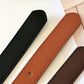 Leather belt straps close-up in black, rust, and dark brown with stitched edges