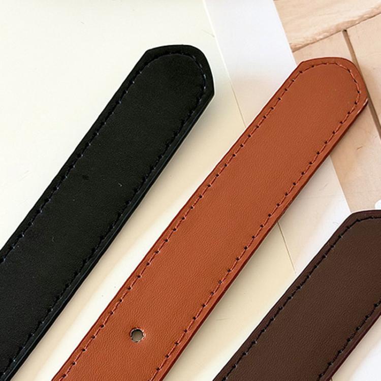 Leather belt straps close-up in black, rust, and dark brown with stitched edges