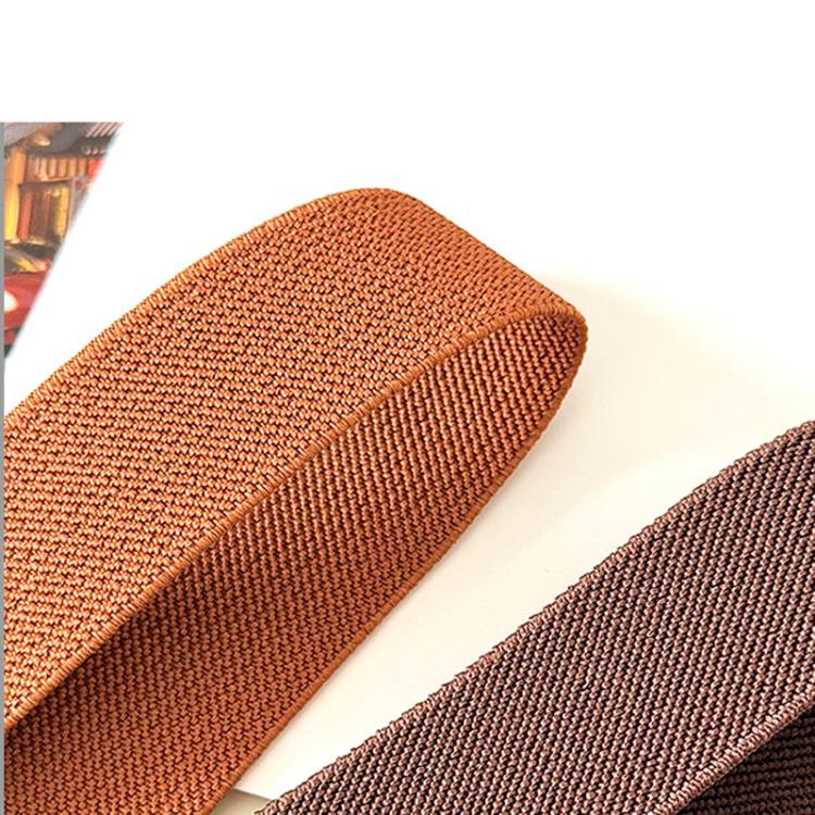 Woven belt straps in rust-brown and dark brown with triangle buckle detail