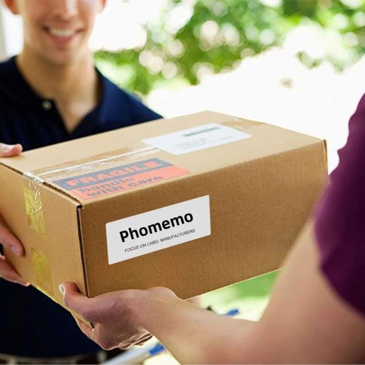 White thermal shipping label stickers on brown shipping boxes