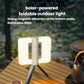 Foldable solar camping lantern with raised solar panel and tripod-like stand