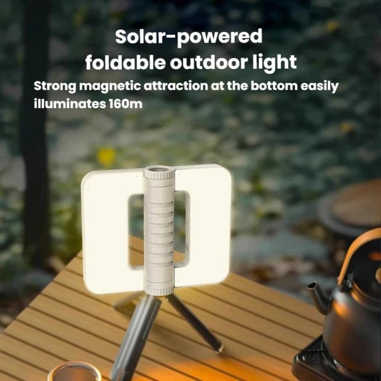 Foldable solar camping lantern with raised solar panel and tripod-like stand