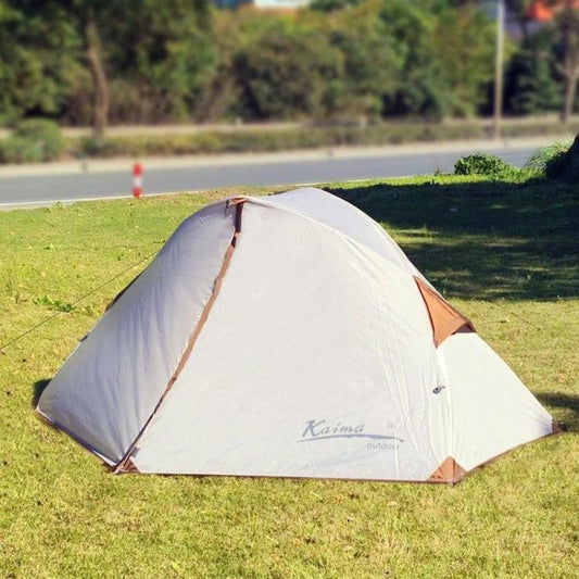 White and tan dome camping tent with front entrance and triangular windows