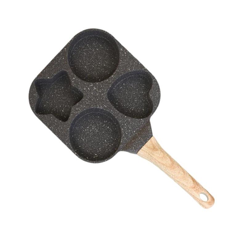 Black four-hole nonstick frying pan with wooden handle and four egg/burger cups