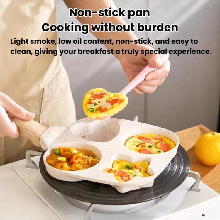 Beige four-hole nonstick frying pan on stovetop, showing shaped egg sections