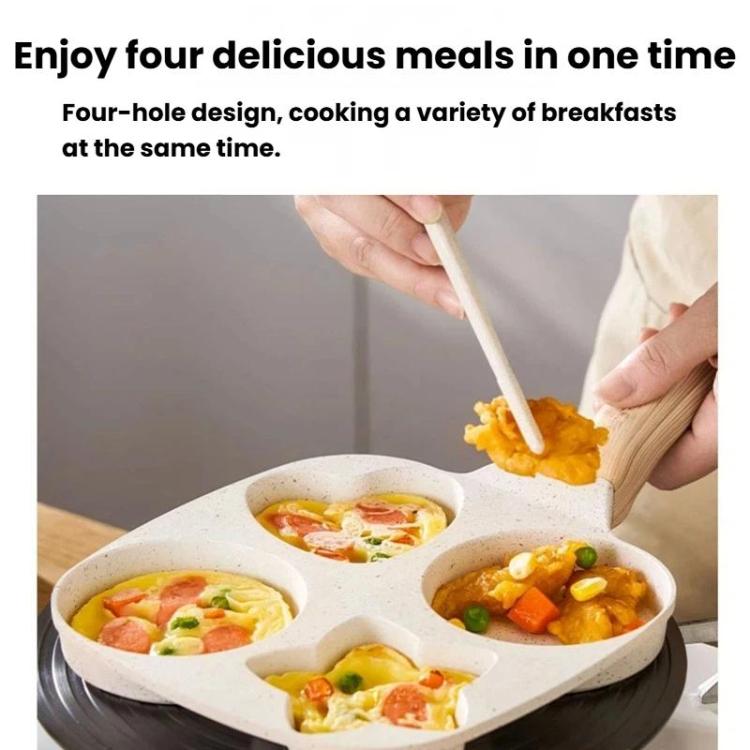 Beige four-hole nonstick frying pan with four cooked egg sections