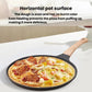 Black non-stick pizza pan with wooden handle holding a topped pizza.