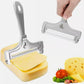 Adjustable thickness cheese slicer with silver metal frame and wire, held by hand