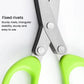 Close-up of riveted scissor joint and stainless blades with bright green handles