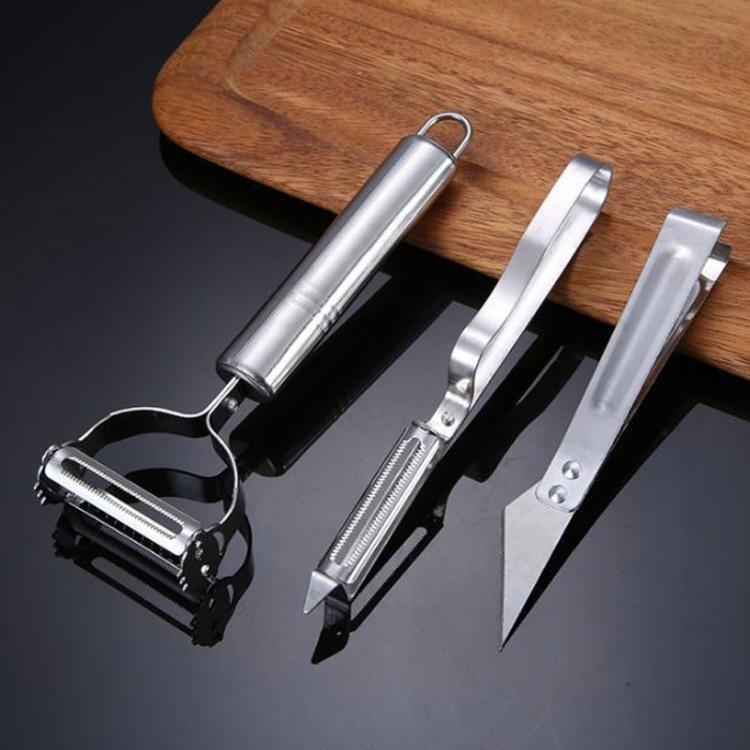 Stainless steel peeler, grater, and additional tool with metal blades in a set