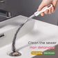 Spiral drain hair removal brush being pulled through bathroom sink drain