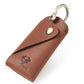 Leather key pouch in brown with metal keyring and snap button closure