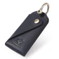 Leather key pouch in dark navy with metal keyring and snap button closure