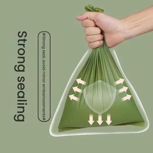 Green poop bag tied at top with leak-proof arrows graphic