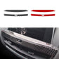 Carbon-fiber dashboard trim stickers in black and red, two-piece set
