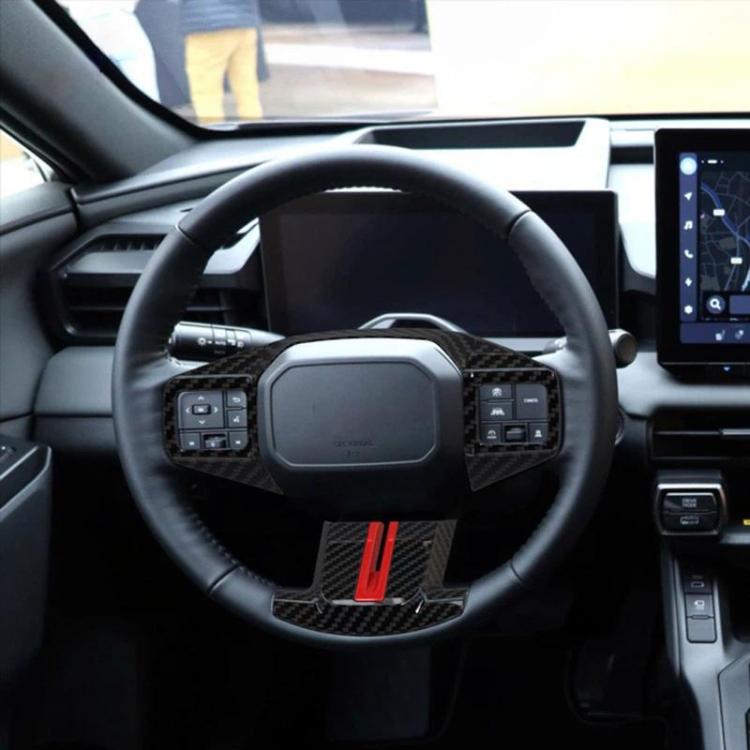 Steering wheel adjustment button trim cover with carbon-fiber pattern and red accent stripe