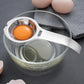 Stainless steel egg yolk separator over bowl, with round strainer cup and handle