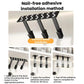 Black under-cabinet cup rack with adhesive mounting pads and angled holder arms