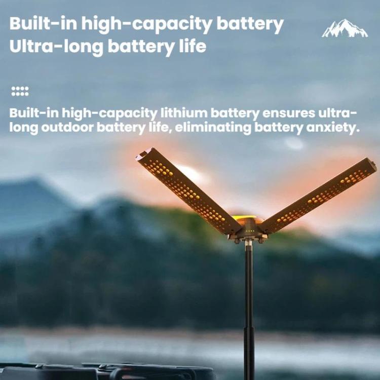 Portable folding LED camping lamp with three illuminated blades extended on tall stand
