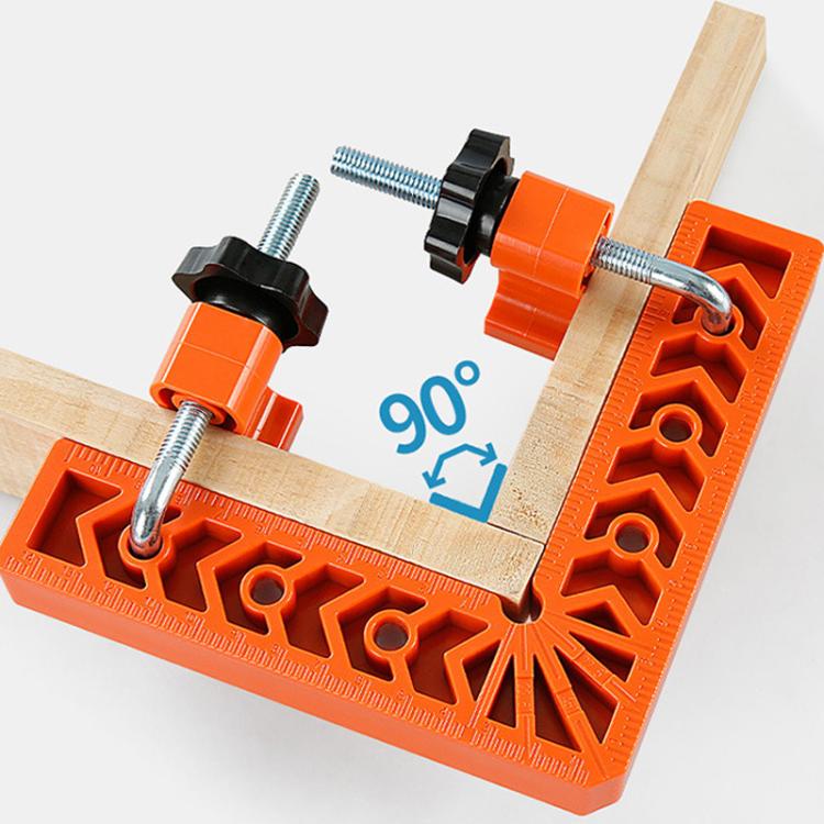 Orange right-angle positioning jig clamp with ruler edge and bolt holes