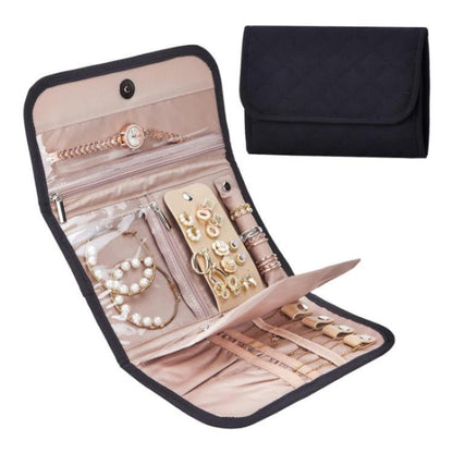 Black faux-suede jewelry storage roll bag with snap flap, open compartments for earrings
