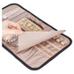 Pink faux-suede jewelry storage roll bag opened flat with ring and earring pockets