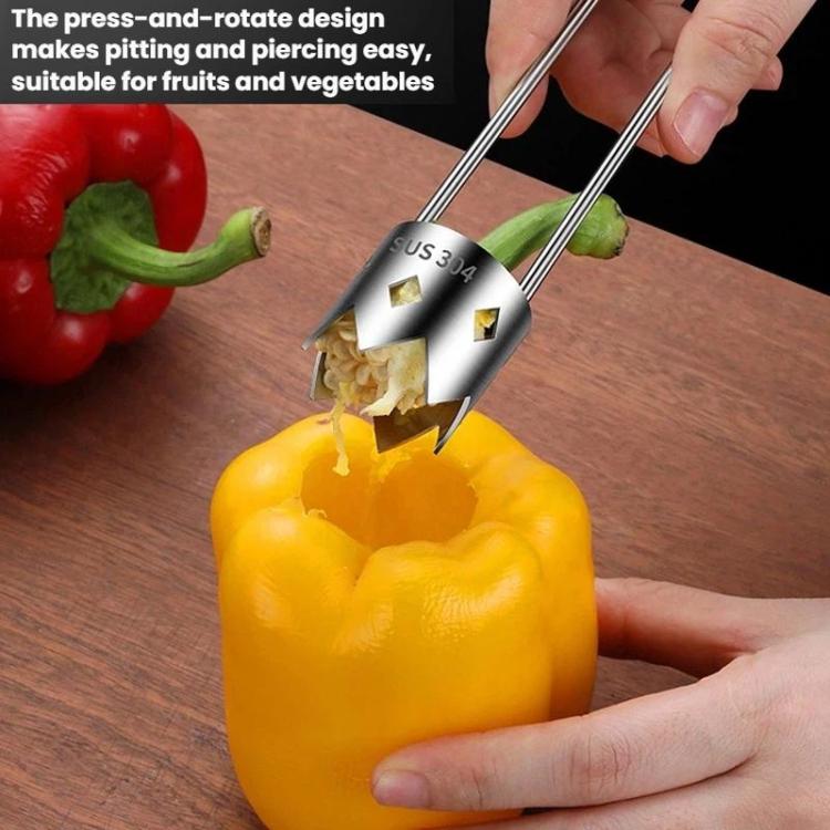 Stainless steel corer pressing into a yellow bell pepper to remove a core