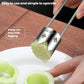 Stainless steel fruit corer with two blades, cutting a hollow in green cucumber