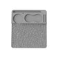Gray silicone espresso tamper mat with leaf-pattern texture and molded tamper holder