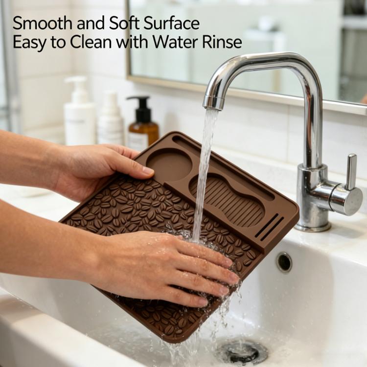 Brown silicone espresso tamper mat being rinsed with water, leaf-pattern texture