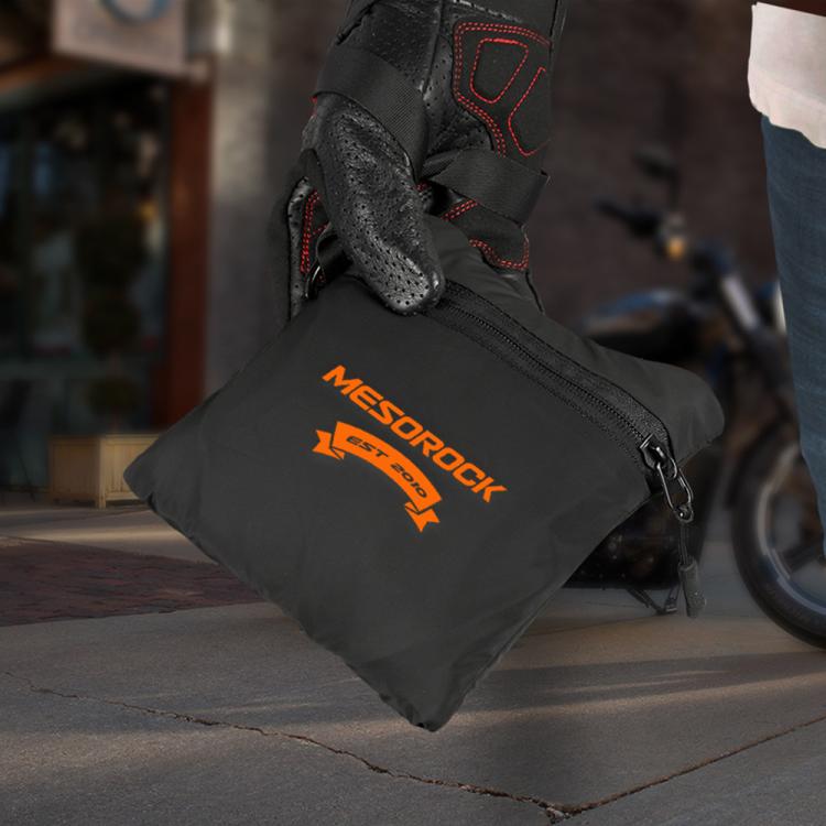 Black waterproof helmet backpack on the floor with front pocket and logo patch
