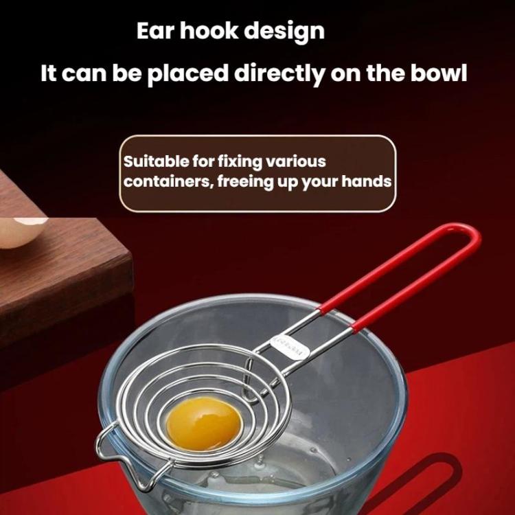 Stainless steel spiral egg white separator over bowl, holding a single egg yolk