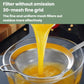 Stainless steel fine mesh strainer spoon draining thick liquid from a pot