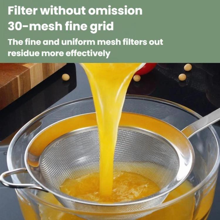 Stainless steel fine mesh strainer spoon draining thick liquid from a pot