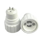White PBT lamp base adapter showing underside with two pins and circular socket contacts
