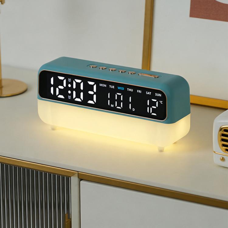 Teal digital alarm clock with LED time display and warm glowing night light