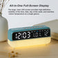 Teal digital alarm clock on desk with LED date and temperature display
