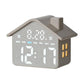 Gray house-shaped digital alarm clock with bright white time digits and day-of-week icons