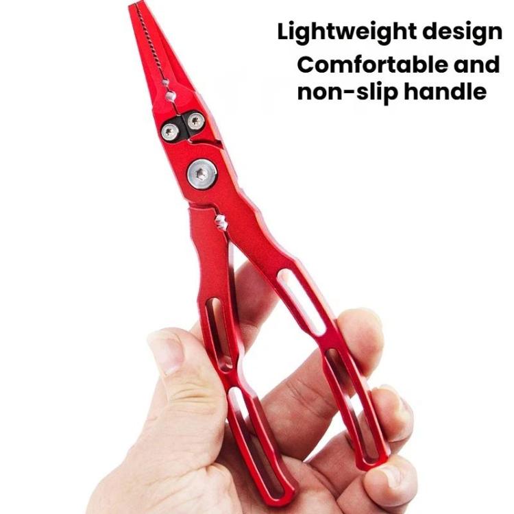 Red fishing lure pliers with serrated jaws, held in hand