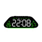 Black digital alarm clock with green LED time display and 7-day labels