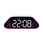 Black digital alarm clock with large pink LED time and weekday display