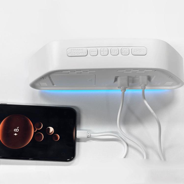 Digital alarm clock with white case, blue LED panel and connected power cables