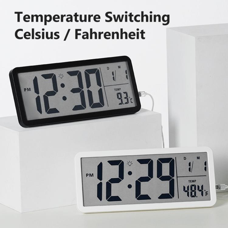 Black LCD digital clock displaying time with temperature readout