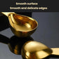 Gold coffee measuring spoon with smooth oval bowl and handle, scale markings on handle