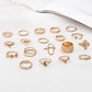 19-piece rose-gold tone ring set with heart, flower, and chain designs, assorted styles