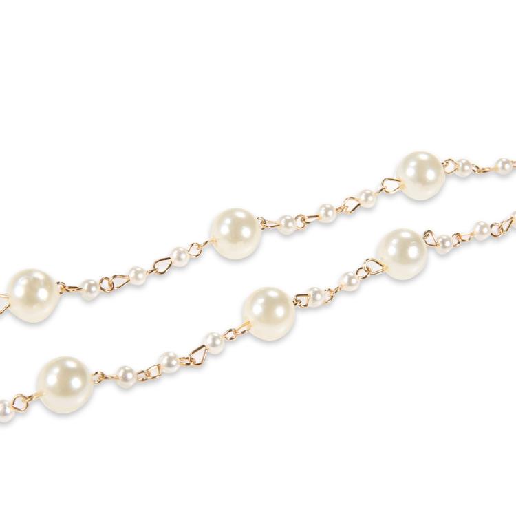Multi-layer pearl anklet close-up with round pearls on gold-tone links