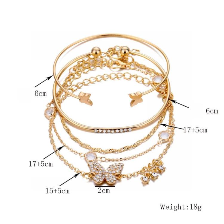 Gold butterfly crystal bracelet set with open cuff and dangling bow and crystal links