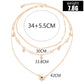 Gold-tone layered star pendant necklace with multiple length measures