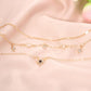 Gold-tone layered star pendant necklace with small clear star charms